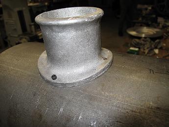  We drill just the two holes perpendicular to the smokebox front at first.  Our holes are okay, but the cumulative errors between the rotary head, the angle of the tilt and the not quite on center part cause us to adjust the holes with a small round rat-tail file.